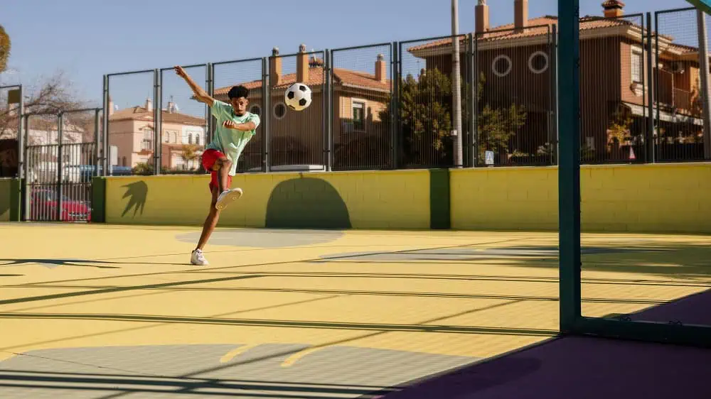 portrait-young-man-playing-football